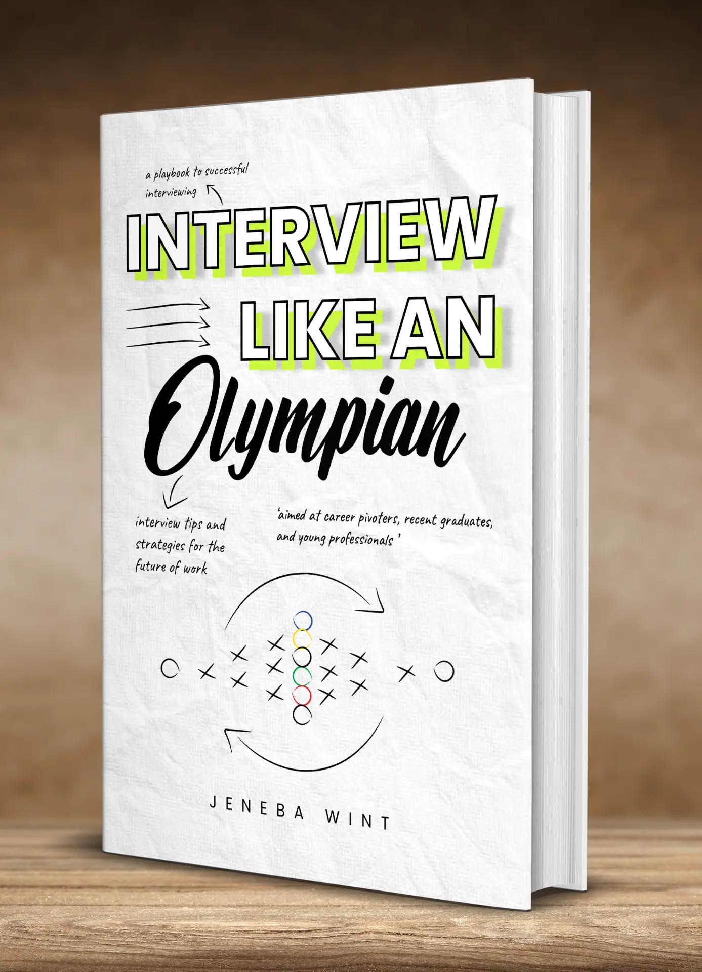 Interview Like an Olympian by Jeneba Wint — front cover mock-up on a wooden surface.